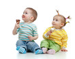 happy children little girl and boy with ice cream in studio isol