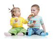 happy children little girl and boy with ice cream in studio isol