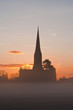 Salisbury cathedral on a misty morning