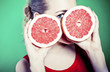 portrait of young attractive woman with grapefruit