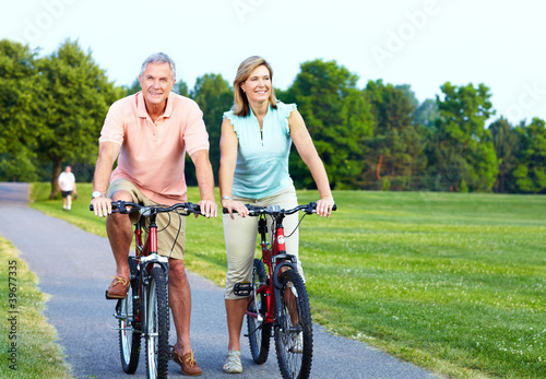 Photo: Senior couple cycling. Senior couple cycling.