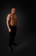 Sexy naked torso fit and neat young man studio full portrait