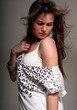 Photo: Young woman beauty fashion pose over grey Young woman beauty fashion pose over grey