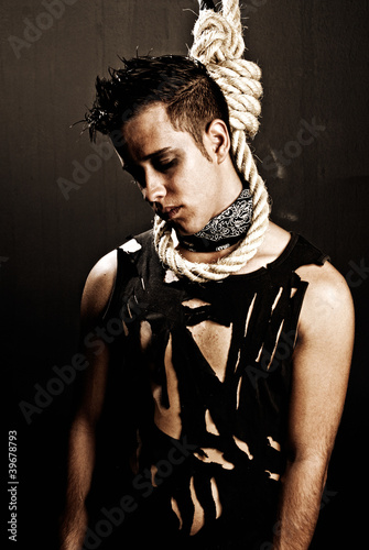 Photo: Young man hanged grunge style dark dead concept Young man hanged grunge style dark dead concept