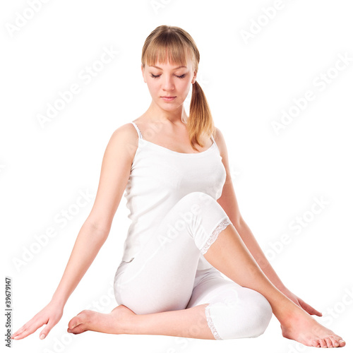 Photo: Young woman doing yoga exercise Young woman doing yoga exercise