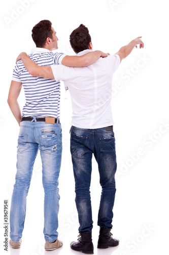 Photo: two young men pointing at somethin two young men pointing at somethin