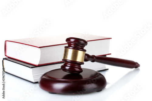 Photo: wooden gavel and books isolated on white wooden gavel and books isolated on white