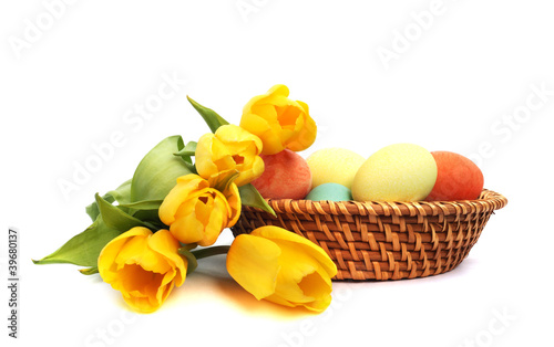 Photo: Easter eggs in basket with tulips Easter eggs in basket with tulips