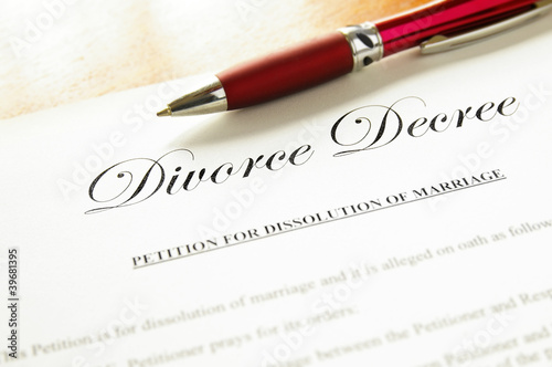 Photo: closeup of a divorce decree document with pen closeup of a divorce decree document with pen