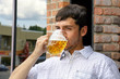 Young man binging on beer