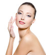 Beautiful woman touching the cheek on face
