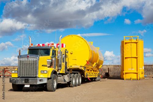 Photo: Yellow Transport With Oilfield Tanks Yellow Transport With Oilfield Tanks