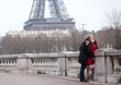Romantic couple in love in Paris, near the Eiffel tower