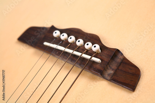 Photo: Guitar bridge and strings Guitar bridge and strings