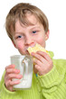 Photo: child eating cake and drinking milk child eating cake and drinking milk