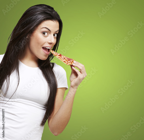 Photo: woman eating pizza woman eating pizza