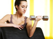 portrait of  young woman lifting free weights