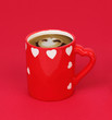 Cup of coffee isolated on red Cup of coffee isolated on red