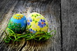 Easter eggs and natural wooden country table Easter eggs and natural wooden country table