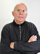 senior man with glasses  and hands crossed on  chest