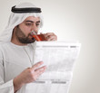 arabian business man reading news- clipping path included