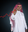 arabian Businessman drawing a graph