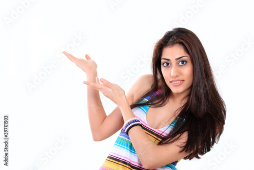 Photo: Cute young lady showing copy space Cute young lady showing copy space