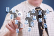 Businessman pressing modern social buttons