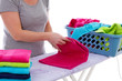 Housewife is folding towels in closeup