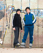 Teenage boys on roller skates posing outdoor