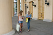 Two girls with vibrant shoping bags