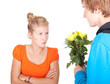 man offering flowers to his girlfriend