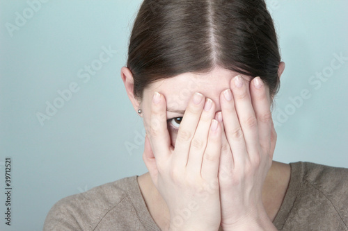 Photo: Young woman hiding Young woman hiding