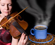 Cup of coffee with woman playing the violin Cup of coffee with woman playing the violin
