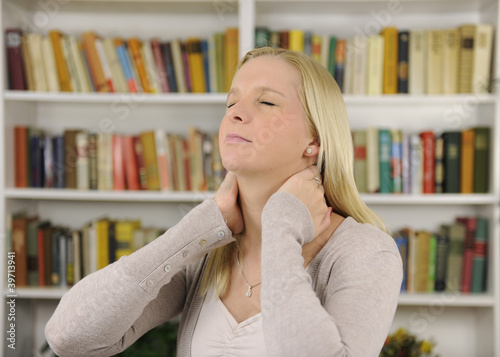 Photo: Woman suffering from severe neck pain Woman suffering from severe neck pain