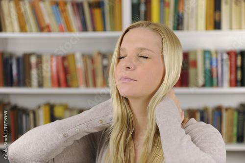 Photo: Woman suffering from severe neck pain Woman suffering from severe neck pain
