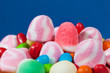 Photo: Candy assortment on blue background Candy assortment on blue background