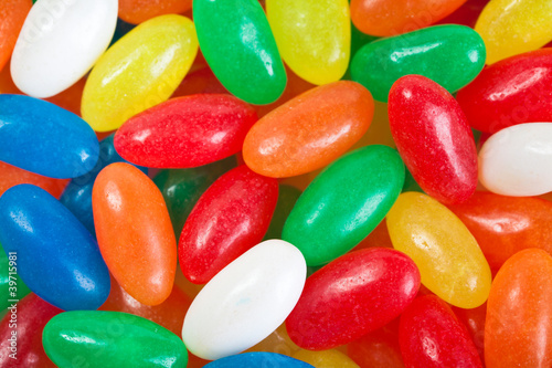 Photo: Multi colored jelly beans background. Close up Multi colored jelly beans background. Close up