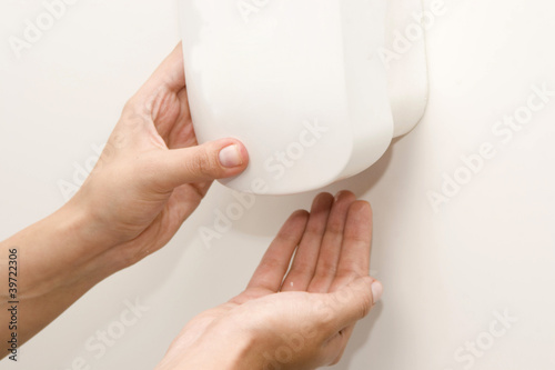 Photo: Wall Mounted Sanitizer Dispenser with Woman Hand Wall Mounted Sanitizer Dispenser with Woman Hand