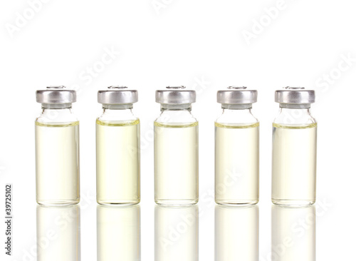 Photo: Medical ampoules isolated on white Medical ampoules isolated on white