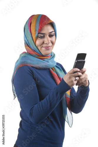 Photo: beautiful stylish islamic girl wearing hijab on the phone beautiful stylish islamic girl wearing hijab on the phone