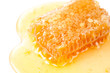 Close-up of yellow honeycomb and honey, studio shot