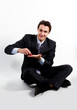 portrait of a young manager for motor with a small red toy car