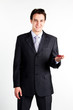 portrait of a young manager for motor with a small red toy car
