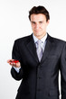 portrait of a young manager for motor with a small red toy car