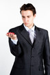 portrait of a young manager for motor with a small red toy car