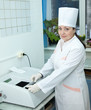 Doctor working with Biochemistry Analyzer