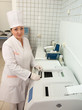 Doctor working with Biochemistry Analyzer