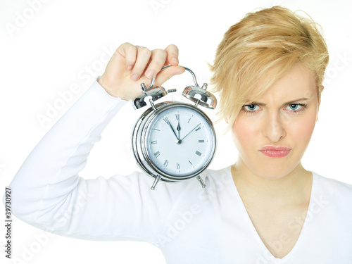 Foto: Pretty woman is annoyed by the early buzzer ring Pretty woman is annoyed by the early buzzer ring
