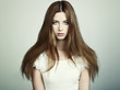 Fashion photo of a young woman with red hair